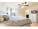 King-size bed, dresser, and ensuite bathroom in a spacious bedroom at 9047 Rhodes St, Kissimmee, FL 34747