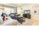 Living room with comfortable seating, a large TV and sliding doors to patio at 9047 Rhodes St, Kissimmee, FL 34747