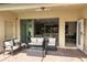 Patio with seating area and view into the living area at 9047 Rhodes St, Kissimmee, FL 34747