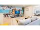 Gathering-friendly game room with a large TV and fun decor at 9047 Rhodes St, Kissimmee, FL 34747