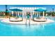 Relaxing resort-style pool with shaded seating and lounge areas at 9047 Rhodes St, Kissimmee, FL 34747