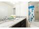 Bathroom with double vanity, granite countertop, and a shower/tub combo at 9047 Rhodes St, Kissimmee, FL 34747
