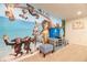 Game room with Madagasgar mural and Playstation at 9047 Rhodes St, Kissimmee, FL 34747