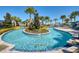 Community lazy river with palm trees and landscaping at 9047 Rhodes St, Kissimmee, FL 34747