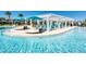 Large community pool with expansive deck, shaded seating, and water features at 9047 Rhodes St, Kissimmee, FL 34747