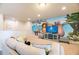 Game room featuring a large TV, comfortable seating, and a playful mural at 9047 Rhodes St, Kissimmee, FL 34747