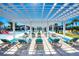 Relaxing pool deck with shaded pergola and comfortable lounge chairs at 9047 Rhodes St, Kissimmee, FL 34747