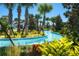 Relaxing lazy river winding through lush landscaping at 9047 Rhodes St, Kissimmee, FL 34747