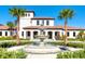 Luxury community center with a grand fountain and manicured landscaping at 9047 Rhodes St, Kissimmee, FL 34747