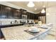 Modern kitchen with granite countertops and stainless steel appliances at 9047 Rhodes St, Kissimmee, FL 34747