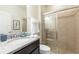 Clean bathroom with a granite vanity and glass shower at 9047 Rhodes St, Kissimmee, FL 34747