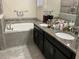 Bathroom with a double vanity and soaking tub at 4183 Cortland Dr, Davenport, FL 33837
