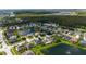 Aerial view of neighborhood with lake and conservation at 3222 Stonehurst Cir, Kissimmee, FL 34741