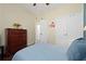 Spacious bedroom with double bed, dresser, and double door closet at 3222 Stonehurst Cir, Kissimmee, FL 34741