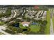 Aerial view of community, pool, tennis courts, and clubhouse at 3222 Stonehurst Cir, Kissimmee, FL 34741