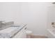 Clean bathroom with granite vanity and modern fixtures at 48 Atlantic Ave, Babson Park, FL 33827