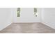 Spacious bedroom with large windows and wood floors at 48 Atlantic Ave, Babson Park, FL 33827