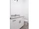 Bathroom featuring a granite countertop vanity and toilet at 48 Atlantic Ave, Babson Park, FL 33827