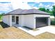 New construction home with a black garage door at 48 Atlantic Ave, Babson Park, FL 33827
