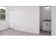 Bedroom with en-suite bathroom and wood-look flooring at 48 Atlantic Ave, Babson Park, FL 33827
