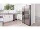 Stainless steel refrigerator in a bright, updated kitchen at 48 Atlantic Ave, Babson Park, FL 33827