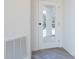White door leading to the back patio at 48 Atlantic Ave, Babson Park, FL 33827
