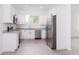 Bright and airy kitchen with stainless steel appliances at 48 Atlantic Ave, Babson Park, FL 33827