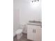 Clean bathroom with white vanity, granite countertop and shower at 48 Atlantic Ave, Babson Park, FL 33827