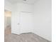 Bright bedroom with spacious closet and wood-look flooring at 48 Atlantic Ave, Babson Park, FL 33827