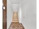Interior entryway with tiled floor, staircase, and doors at 2532 Grand Central Pkwy # 18, Orlando, FL 32839