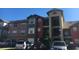 Exterior view of a two-story apartment building with ample parking at 2203 Key West Ct # 436, Kissimmee, FL 34741
