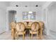 Charming dining room with a wooden table and six chairs at 7959 Magnolia Bend Ct, Kissimmee, FL 34747