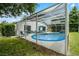 Large screened pool and patio area with lush landscaping at 7959 Magnolia Bend Ct, Kissimmee, FL 34747
