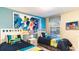 ' bedroom with twin beds and fun wall decor at 1495 Rolling Fairways Dr, Davenport, FL 33896