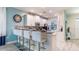Modern kitchen with a breakfast bar and stainless steel appliances at 1495 Rolling Fairways Dr, Davenport, FL 33896