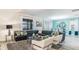 Spacious living room with sectional sofa and large windows at 1495 Rolling Fairways Dr, Davenport, FL 33896