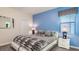 Bedroom with king-size bed and modern decor at 1495 Rolling Fairways Dr, Davenport, FL 33896