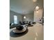 Kitchen features a breakfast bar and modern pendant lights at 718 Longboat Dr, Davenport, FL 33896