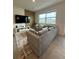 Relaxing living room with sectional sofa and large window at 718 Longboat Dr, Davenport, FL 33896