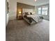 Spacious main bedroom with plush carpet, large bed, and wood accent wall at 718 Longboat Dr, Davenport, FL 33896