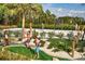 Community mini golf course next to a sand volleyball court at 718 Longboat Dr, Davenport, FL 33896
