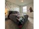 Star Wars themed bedroom with a full-size bed and accent wall at 718 Longboat Dr, Davenport, FL 33896