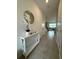 Bright and airy entryway with tile flooring and a console table at 718 Longboat Dr, Davenport, FL 33896