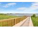 Wooden walkway offering scenic views of the lake at 899 Griffon Ave, Lake Alfred, FL 33850