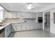 Modern kitchen with gray cabinets and granite countertops at 1500 8Th Se St, Winter Haven, FL 33880