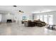Spacious living room featuring tile floors, a fireplace, and access to the backyard pool at 1500 8Th Se St, Winter Haven, FL 33880