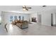 Bright living room with tile floors, fireplace, and view to the backyard pool at 1500 8Th Se St, Winter Haven, FL 33880