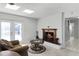 Cozy living room with a fireplace and view of the backyard at 1500 8Th Se St, Winter Haven, FL 33880