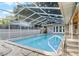 Inviting screened-in pool with patio and surrounding fence at 1500 8Th Se St, Winter Haven, FL 33880