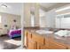 Bathroom with a single sink vanity and access to a bedroom at 476 Calabay Parc Blvd, Davenport, FL 33897